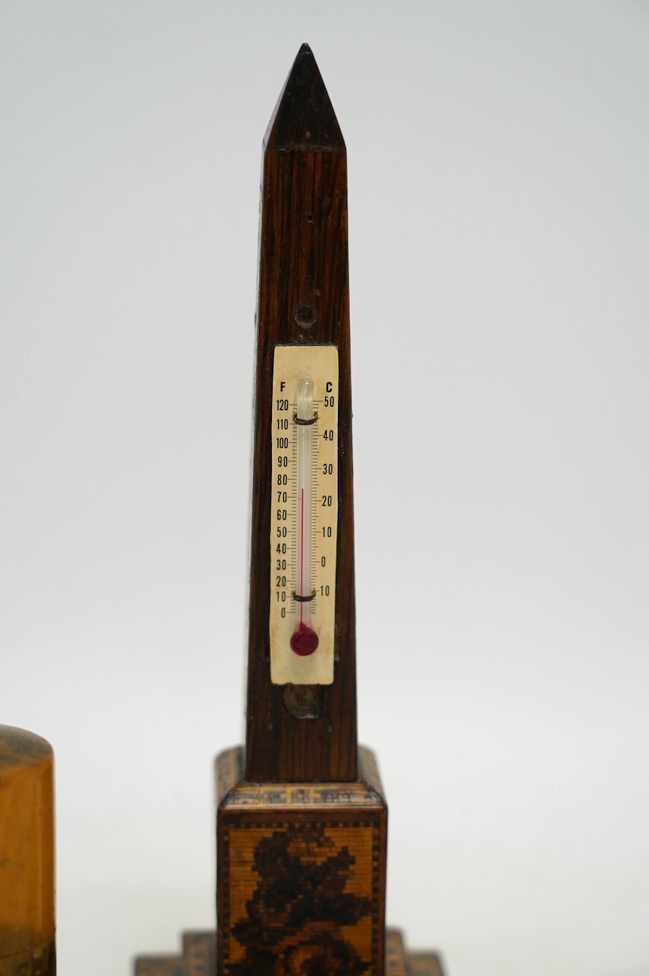 A Tunbridge ware obelisk thermometer, a Mauchline ware box and cover, and a carved bread knife, largest 32cm long. Condition - fair to good